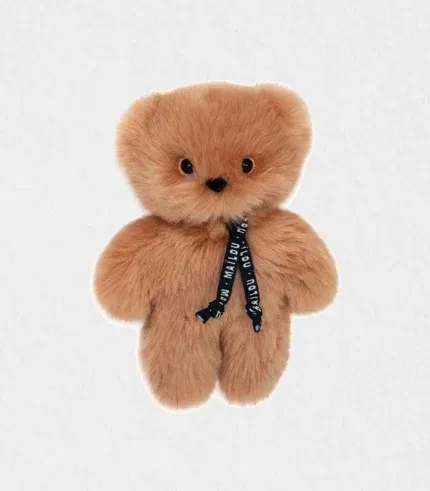Close-up of the plush baby bear’s velvety Maïloudou fur and embroidered features showcasing its handmade craftsmanship—plush baby bear Dubai baby gift shipped worldwide.