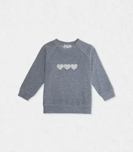 girls washed blue sweater